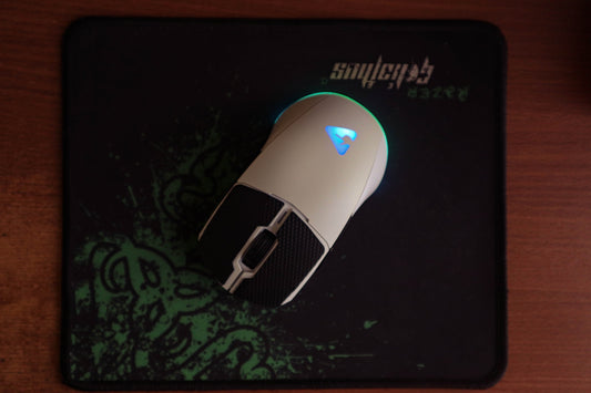 a close up of a mouse on a mouse pad