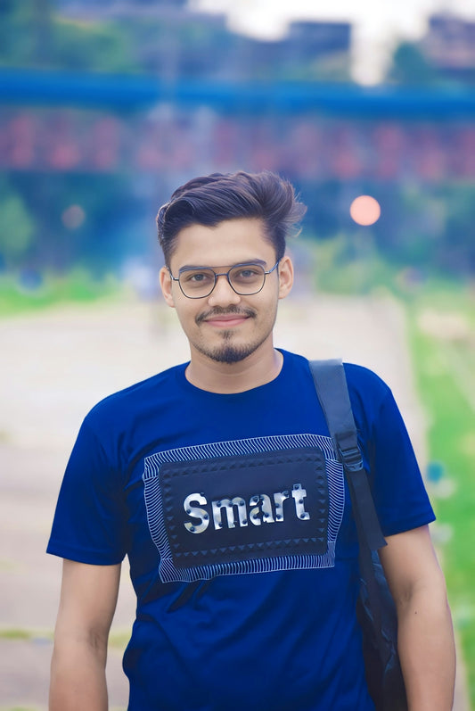 a man wearing a smart t - shirt and carrying a backpack