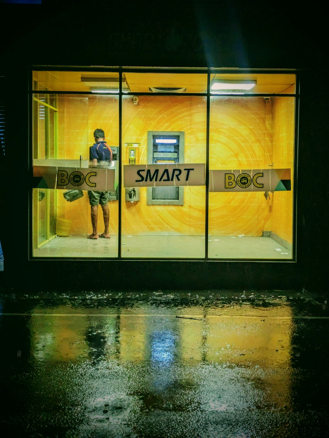 A man standing in front of a smart phone store