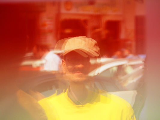 man wearing yellow cap and T-shirt